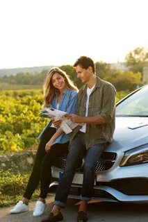 Beautiful Pair Laughing in Car on Road Trip Stock Photo - Im