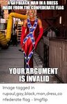 A GAY BLACK MAN INA DRESS MADE FROM THE CONFEDERATE FLAG YOU