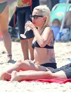 Lady Gaga In a black two piece bikini while frolicking in th