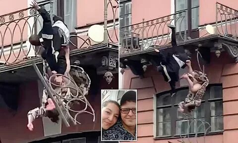 Terrifying moment couple plunge from second-floor balcony 'd