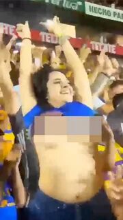 The excited Tigres fan was celebrating her team scoring a tie-breaking pena...