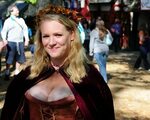 Smiling blonde at Renfest Beautiful blond girl arrives at . 