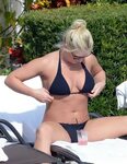 brooke hogan spotted while relaxing by the poolside in a bla