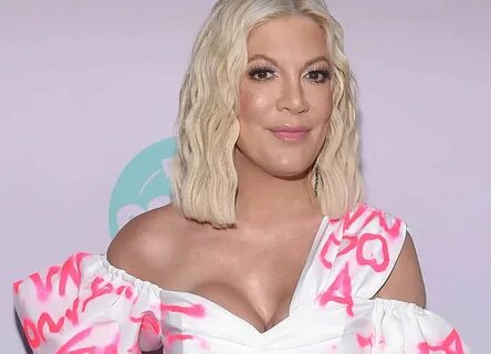 Why Tori Spelling Is Getting Her Breast Implants Removed Rea