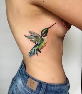Humming bird boob tattoo