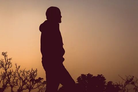 Silhouette of walking man at sunset sky free image download