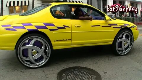 Yellow/Purple Chevy Monte Carlo SS on 30" DUB Markee Floater