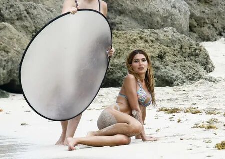 Juliana Proven posing in blue thong bikini sets at the beach