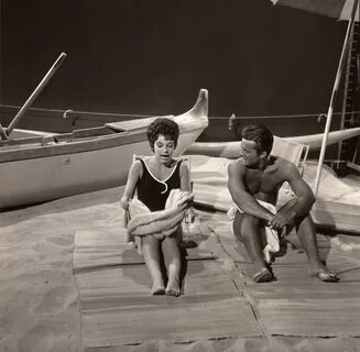 Robert Conrad and Karen Kupcinet on a soundstage beach, Ha. 