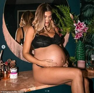 Pregnant Ashley James displays her burgeoning baby bump in a