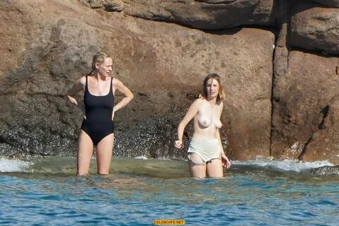 Maya Hawke topless on a beach at St. Barts with her mom Uma 