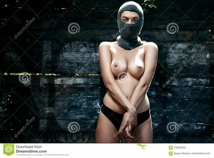 Gangster Girl in a Masked Balaclava, Naked with an Open Che Stock Image - Image 