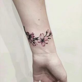 Cute Feminine Flower Armband Tattoo On Wrist - Tattoo Design