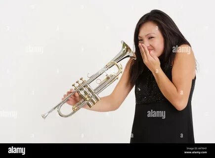 Blow trumpet woman hi-res stock photography and images - Alamy