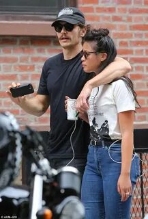 James Franco cosies up to mystery woman as he walks through 