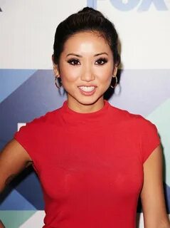 Brenda Song wore her hair in a polished bun with a sexy smok