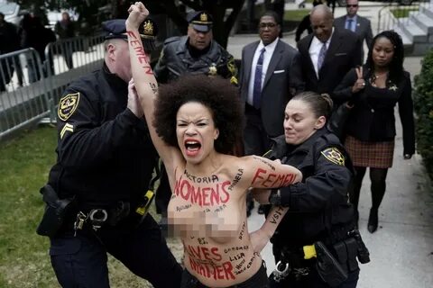 Topless protester who acted in 'Cosby Show' rushes Bill Cosb