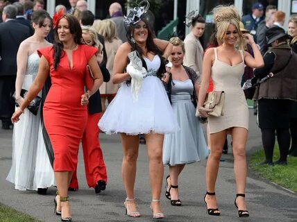 Ladies day at the Grand National: high heels, beer and horse