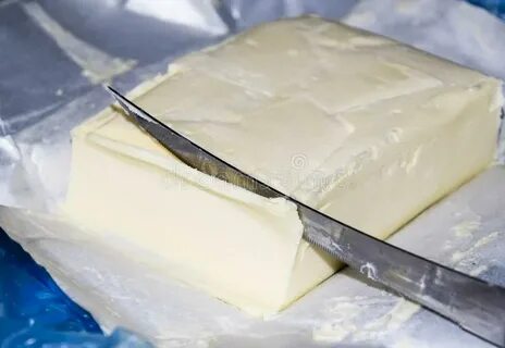 Cutting a Butter Knife. Butter and Knife Stock Image - Image