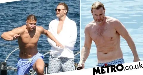 Gary Barlow soaks up rays with lookalike son on family getaw