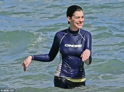 Brave Anne Hathaway returns to the water just one day after 