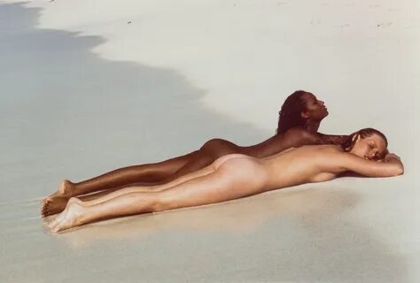 Iman, unidentified woman on beach by Francesco Scavullo (1969) .