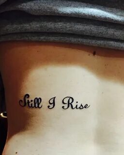 Still I Rise tattoo on mid back inspired by the late Maya An