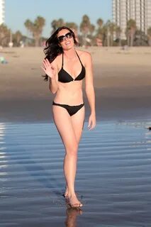 Courtney Robertson shows off her ass wearing bikini on a bea