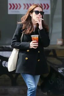EMMA ROBERTS Smokes a Cigarette Out in New York 03/30/2017 -