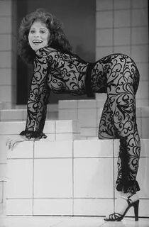 Actress Anita Morris wearing her famous lace bodysuit during