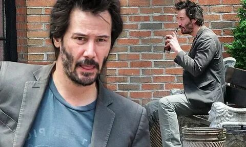 Keanu Reeves has a solitary drink outside his NYC hotel