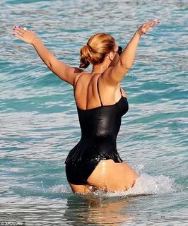 Beyonce poses on a jet ski for husband Jay-Z as they holiday