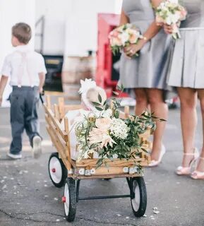 Flowers added to flower girls wagon. Courtesy of Scott Andre