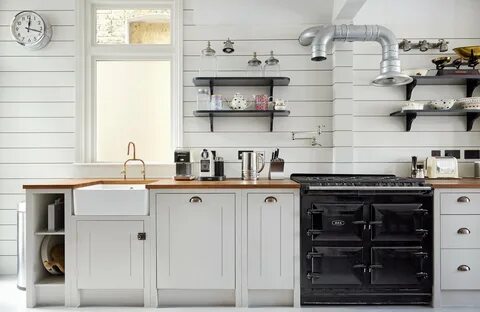 Shiplap wood paneling in a classic English kitchen remodel