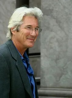 Richard Gere with silver hair and sporting a classic layered