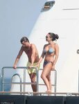 Tamara Ecclestone slips into a bikini as she disembarks from