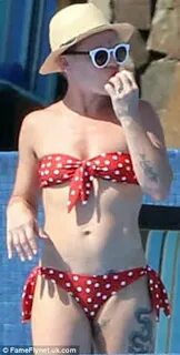 Pink shows off her sculpted figure in a polka dot bikini whi