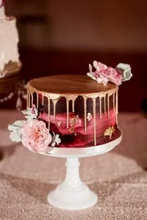 Burgundy painted wedding cake with gold drip and gold leaf, 