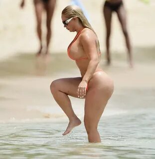 Nicole Coco Austin showing off her hourglass curves in orang