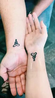 Matching mother daughter tattoos - symbol is Celtic knot rep