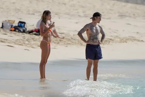 Hailey Baldwin in a tiny colorful bikini with Justin Bieber 
