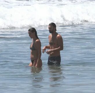 Brandon Jenner shirtless swimming in the ocean with a pregnant girlfriend, ...