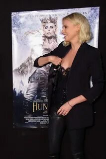 Charlize Theron nipple-slip in sheer black outfit at The Hun