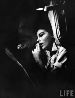 Peter Stackpole - Ava Gardner smoking a cigarette in a scene