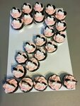 Pink Minnie mouse pull-apart cupcake cake in the shape of a 