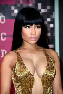 Nicki Minaj Showing off her huge cleavage & big booty in a g