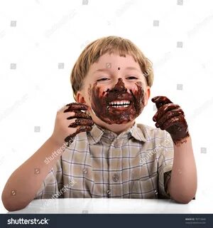 Funny Cute Dirty Bedaubed Boy Chocolate: стоковая фотография