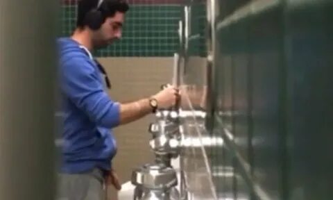 guy in sweatpants caught peeing at urinal - Spycamfromguys, 