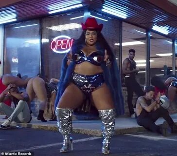 Lizzo dips low in sequined lingerie as she raps with Missy E