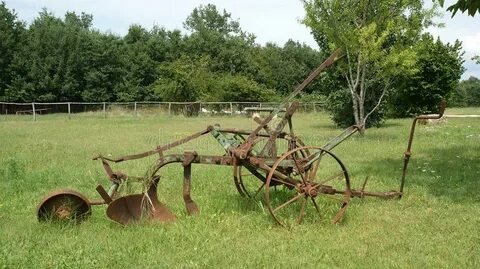 Antique Plow at a Farm in the Summer Field Stock Image - Ima